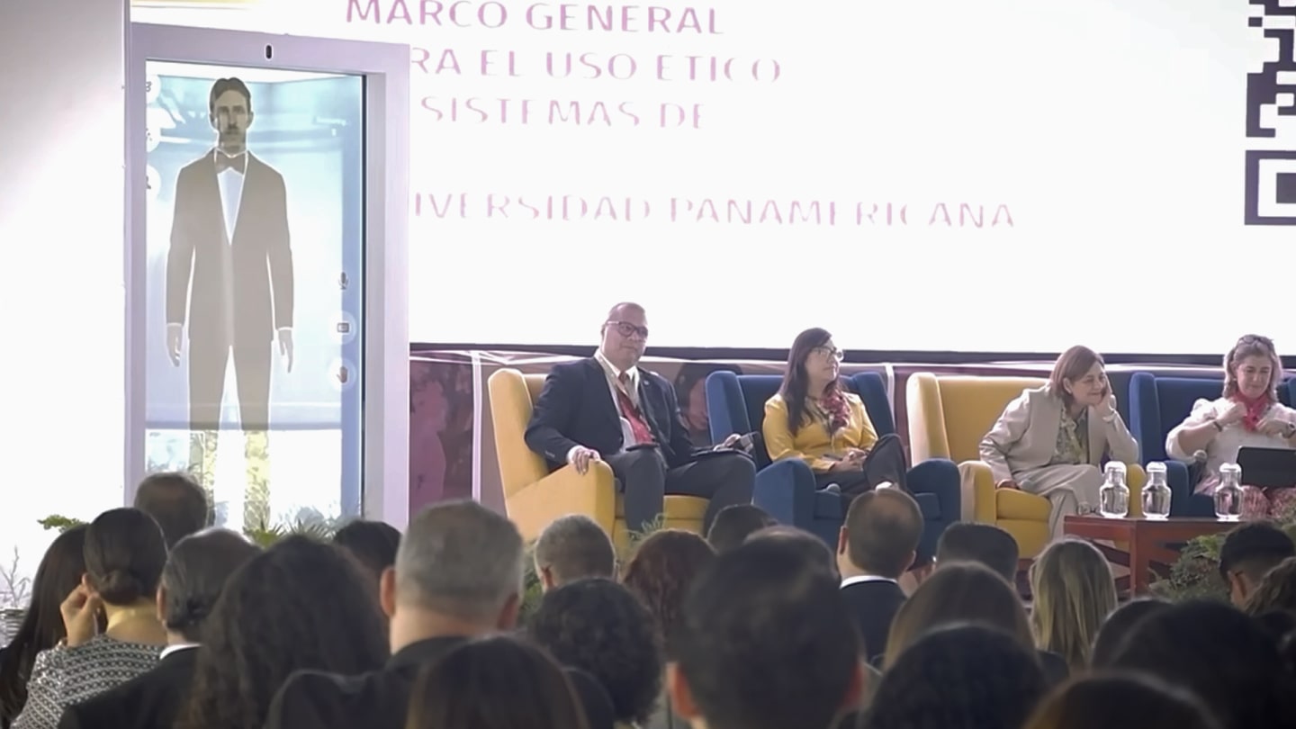 interactive holographic Tesla AI avatar engaging university audience in AI and innovation discussion